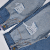 jean mom bicolor con roturas